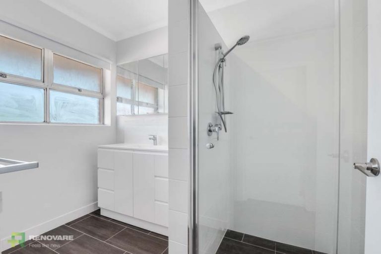 Apartment bathroom renovation featuring vanity and shower