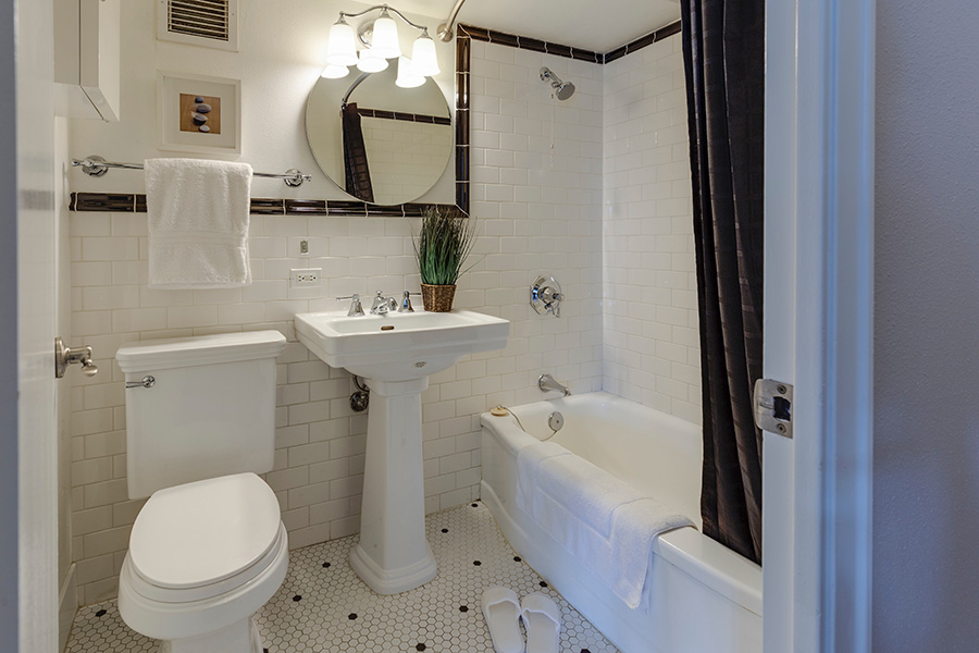 Bathroom with tub and shower curtain