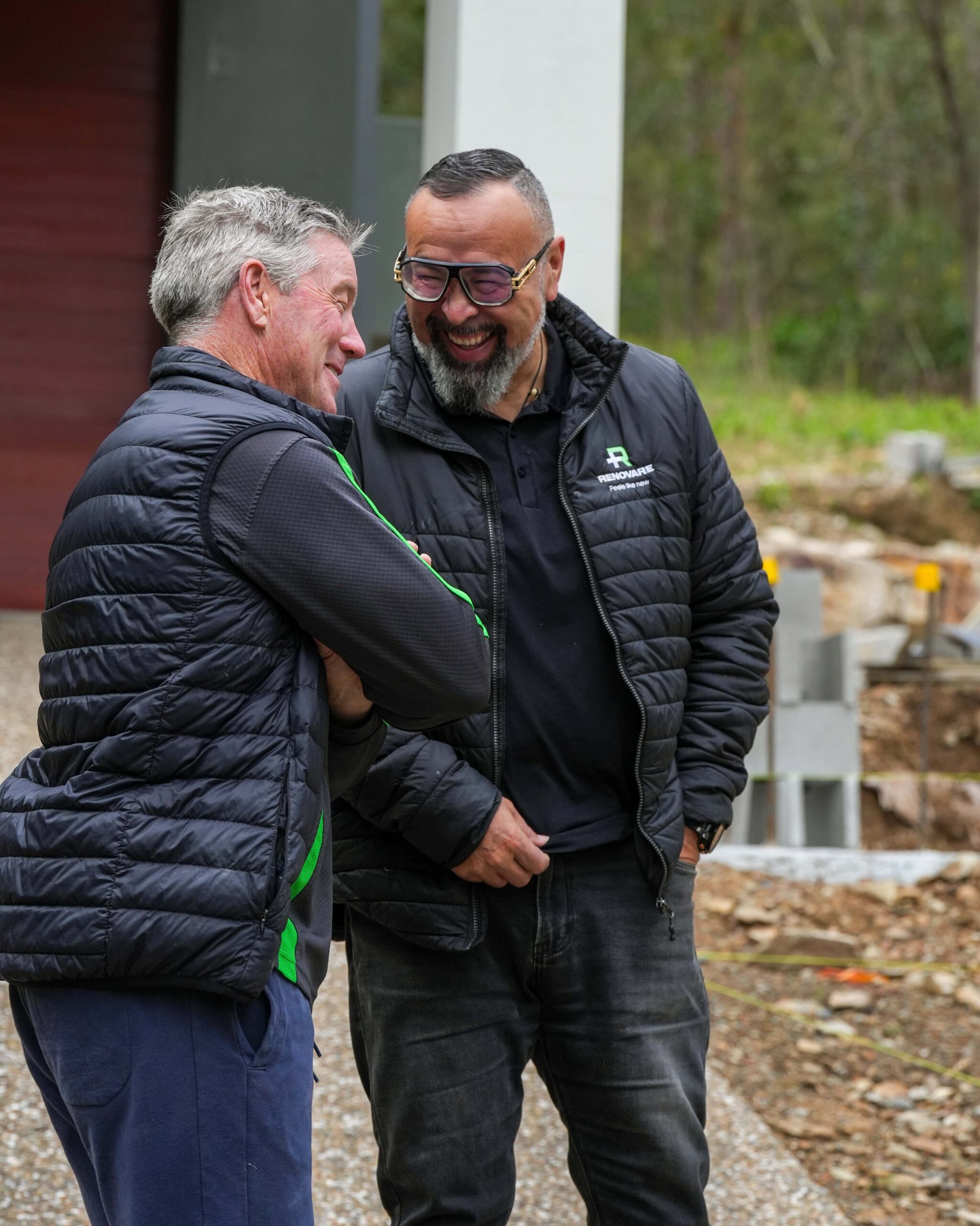 Renovare staff having a conversation on site.