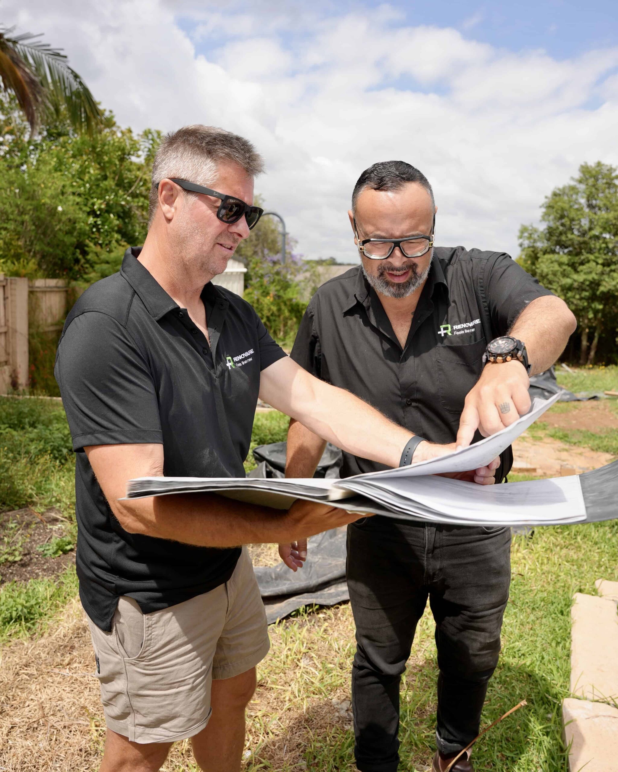 Two men going over plans.